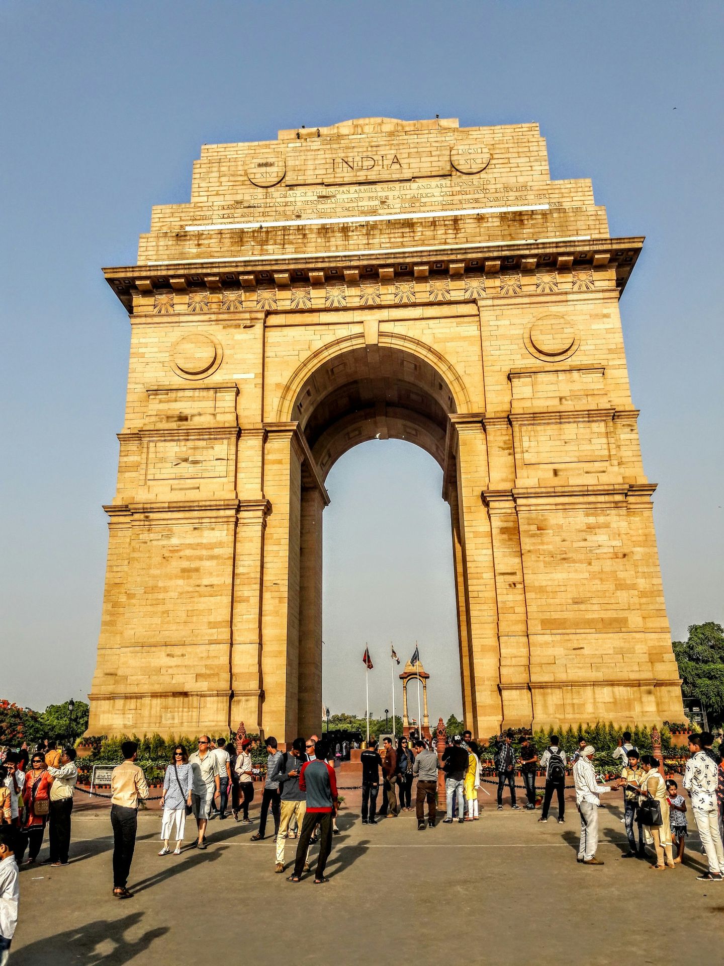 people walking on brown concrete arch during daytime